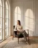 Ireo Lounge Chair shown in a hotel interior with a seated guest
