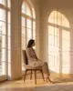 Miller Dining Chair shown in a hotel interior with a seated guest