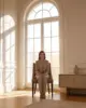 Sk Dining Chair shown in a hotel interior with a seated guest