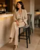 High Back Bar Stool shown in a hotel interior with a seated guest