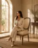 Mok Dining Chair shown in a hotel interior with a seated guest