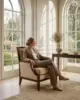 Morris Lounge Chair shown in a hotel interior with a seated guest