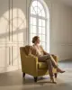 Myst Lounge Chair shown in a hotel interior with a seated guest