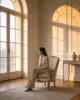 Pin Lounge Chair shown in a hotel interior with a seated guest
