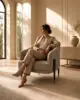 Pleated Tub Lounge Chair shown in a hotel interior with a seated guest