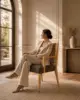 Rattan Back Dining Chair shown in a hotel interior with a seated guest
